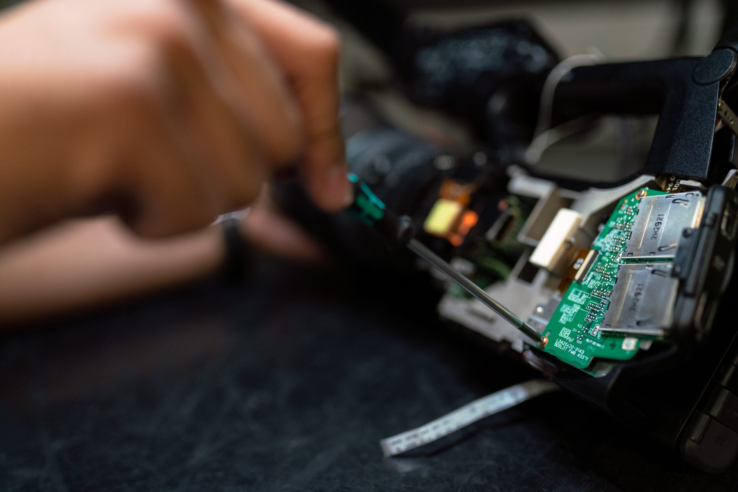 Broadcast engineer maintains camera circuitry